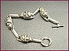 4 Grinnin' Skulls - Bracelet